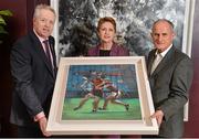 7 February 2014; Former President of Ireland Mary McAleese and husband Martin are presented with a painting by Ulster GAA President Martin McAviney, left. The Croke Park Hotel, Jones's Road, Dublin. Picture credit: Ramsey Cardy / SPORTSFILE