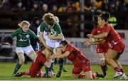 7 February 2014; Jenny Murphy, Ireland, is tackled by Jenny Hawkins, left, and Lowri Harries, Wales. Women's Six Nations Rugby Championship, Ireland v Wales, Ashbourne RFC, Ashbourne, Co. Meath. Picture credit: Ramsey Cardy / SPORTSFILE
