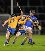 7 February 2014; Conor O'Brien, Tipperary, in action against David Raidy, Clare. Waterford Crystal Cup Final, Clare v Tipperary,  Gaelic Grounds, Limerick. Photo by Sportsfile