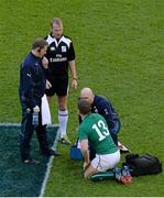 8 February 2014; Brian O'Driscoll, Ireland, is attended to by team doctor Dr. Eanna Falvey, team physio James Allen, left, as referee Wayne Barnes looks on. RBS Six Nations Rugby Championship, Ireland v Wales, Aviva Stadium, Lansdowne Road, Dublin. Picture credit: Brendan Moran / SPORTSFILE