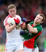 9 February 2014; Peter Hughes, Tyrone, in action against Colm Boyle, Mayo. Allianz Football League Division 1 Round 2, Tyrone v Mayo, Healy Park, Omagh, Co. Tyrone. Picture credit: Oliver McVeigh / SPORTSFILE