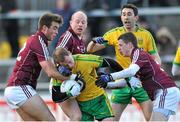 9 February 2014; Anthony Thompson, Donegal, is tackled by Paul Conroy, James Kavanagh and Paul Varley, Galway. Allianz Football League, Division 2, Round 2, Galway v Donegal, Pearse Stadium, Salthill, Galway. Picture credit: Ray Ryan / SPORTSFILE