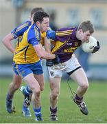 9 February 2014; Michael Furlong, Wexford, in action against Ciarain Murtagh, Roscommon. Allianz Football League Division 3 Round 2, Roscommon v Wexford, Kiltoom, Co. Roscommon. Picture credit: David Maher / SPORTSFILE