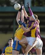 9 February 2014; Cathal Shine, Roscommon, in action against Paddy Byrne and Cillian Kehoe, Wexford. Allianz Football League Division 3 Round 2, Roscommon v Wexford, Kiltoom, Co. Roscommon. Picture credit: David Maher / SPORTSFILE