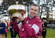 9 February 2014; Jockey Brian O'Connell holds up the Gold Cup after victory in The Hennessy Gold Cup on Last Instalment. Leopardstown Racecourse, Leopardstown, Co. Dublin. Picture credit: Barry Cregg / SPORTSFILE