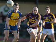 9 February 2014; Cathal Shine, Roscommon, in action against James Holmes, Wexford. Allianz Football League Division 3 Round 2, Roscommon v Wexford, Kiltoom, Co. Roscommon. Picture credit: David Maher / SPORTSFILE