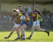 9 February 2014; Donie Shine, Roscommon, in action against Brian Malone, Wexford. Allianz Football League Division 3 Round 2, Roscommon v Wexford, Kiltoom, Co. Roscommon. Picture credit: David Maher / SPORTSFILE