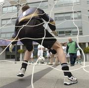 15 June 2005; Republic of Ireland Assistant manager Noel O'Reilly takes a penalty against goalkeeper and team captain Dermot Haverty at the launch of the Anglo Irish Bank Republic of Ireland team for the Homeless World Cup which will be played in Edinburgh, Scotland, from the 20 to 27 July 2005. IFSC, Dublin. Picture credit; Pat Murphy / SPORTSFILE