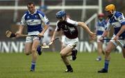18 June 2005; Damien Hayes, Galway, races clear of Laois players Enda Meagher, left, and Joe Fitzpatrick. Guinness All-Ireland Senior Hurling Championship Qualifier, Round 1, Laois v Galway, O'Moore Park, Portlaoise, Co. Laois. Picture credit; Ray McManus / SPORTSFILE