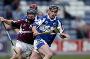 18 June 2005; Packie Cuddy, Laois, prepares to clear under pressure from Damien Hayes, Galway. Guinness All-Ireland Senior Hurling Championship Qualifier, Round 1, Laois v Galway, O'Moore Park, Portlaoise, Co. Laois. Picture credit; Ray McManus / SPORTSFILE