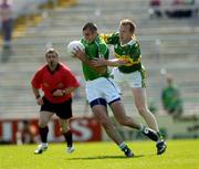 19 June 2005; John Glavin, Limerick, is tackled by Liam Hassett, Kerry, under the watchful eye of referee Eugene Murtagh. Bank of Ireland Munster Senior Football Championship Semi-Final, Limerick v Kerry, Gaelic Grounds, Limerick. Picture credit; Ray McManus / SPORTSFILE