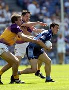 19 June 2005; Colin Moran, Dublin, in action against Paraic Curtis and David Fogarty, left, Wexford. Bank of Ireland Leinster Senior Football Championship Semi-Final, Dublin v Wexford, Croke Park, Dublin. Picture credit; Damien Eagers / SPORTSFILE