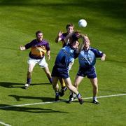 19 June 2005; Dublin's Paddy Christie in action against Wexford's David Fogarty as team-mate Peadar Andrews and Wexford's PJ. Banville look on. Bank of Ireland Leinster Senior Football Championship Semi-Final, Dublin v Wexford, Croke Park, Dublin. Picture credit; Brian Lawless / SPORTSFILE