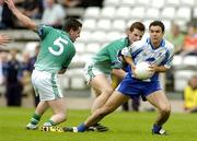 18 June 2005; Stephen Gollogly, Monaghan, in action against Johnny Niblock, 5, and Damian McKenna, London. Bank of Ireland All-Ireland Senior Football Championship Qualifier, Round 1, Monaghan v London, St. Tighernach's Park, Clones, Co. Monaghan. Picture credit; Pat Murphy / SPORTSFILE