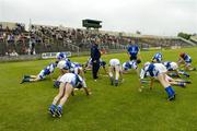 18 June 2005; The Laois players warm up before the game under the watchful eye of manager Paudie Butler. Guinness All-Ireland Senior Hurling Championship Qualifier, Round 1, Laois v Galway, O'Moore Park, Portlaoise, Co. Laois. Picture credit; Ray McManus / SPORTSFILE