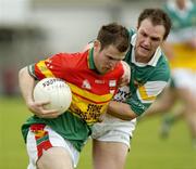 18 June 2005; Simon Rea, Carlow, in action against Scott Brady, Offaly. Bank of Ireland All-Ireland Senior Football Championship Qualifier, Round 1, Carlow v Offaly, Dr. Cullen Park, Co. Carlow. Picture credit; Damien Eagers / SPORTSFILE