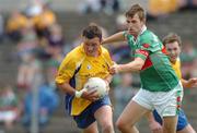 19 June 2005; Brian Higgins, Roscommon, in action against Ronan McGarrity, Mayo. Bank of Ireland Connacht Senior Football Championship Semi-Final, Mayo v Roscommon, Dr. Hyde Park, Roscommon. Picture credit; David Maher / SPORTSFILE