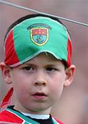 19 June 2005; A young Mayo supporter watches on during the game. Bank of Ireland Connacht Senior Football Championship Semi-Final, Mayo v Roscommon, Dr. Hyde Park, Roscommon. Picture credit; David Maher / SPORTSFILE