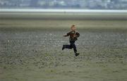 21 June 2005; A young race fan gets some practice in during the ESB BHAA Mid-Summer 5K Beach Race. Sandymount Strand, Dublin. Picture credit; Brian Lawless / SPORTSFILE