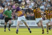 22 June 2005; Marty Kelly, Wexford, is tackled by Michael Fennelly, Kilkenny. U21 Leinster Hurling Championship Semi-Final, Wexford v Kilkenny, Wexford Park, Wexford. Picture credit; Matt Browne / SPORTSFILE