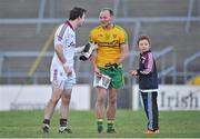 9 February 2014; Galway goalkeeper Manus Breathnach, left, congratulates Donegal's Colm McFadden as he signs an autograph for a young Galway fan after the game. Allianz Football League, Division 2, Round 2, Galway v Donegal, Pearse Stadium, Salthill, Galway. Picture credit: Ray Ryan / SPORTSFILE