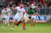 9 February 2014; David Drake, Mayo, in action against Tiaran McCann, Tyrone. Allianz Football League, Division 1, Round 2, Tyrone v Mayo, Healy Park, Omagh, Co. Tyrone. Picture credit: Oliver McVeigh / SPORTSFILE