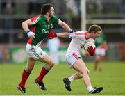 9 February 2014; Peter Hughes, Tyrone, in action against David Drake, Mayo. Allianz Football League, Division 1, Round 2, Tyrone v Mayo, Healy Park, Omagh, Co. Tyrone. Picture credit: Oliver McVeigh / SPORTSFILE
