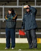9 February 2014; Kerry manager Eamonn Fitzmaurice, left, and selector Diarmuid Murphy attempt to shield their eyes from the sun before the game. Allianz Football League Division 1 Round 2, Kerry v Derry, Fitzgerald Stadium, Killarney, Co. Kerry. Picture credit: Diarmuid Greene / SPORTSFILE