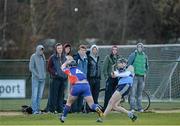 11 February 2014; Walter Walsh, University College Dublin, clears under pressure from Andrew Ryan, Mary Immaculate College Limerick. Irish Daily Mail HE GAA Fitzgibbon Cup 2014, Group B, Round 3, University College Dublin v Mary Immaculate College Limerick, UCD, Belfield, Dublin. Picture credit: Barry Cregg / SPORTSFILE