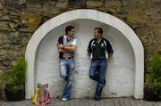 21 June 2005; Tipperary's Benny Dunne and Ben O'Connor, Cork, right, during a photocall ahead of this weekend's Guinness Munster Senior Hurling Championship Final. Ely Place, Dublin. Picture credit; Ray McManus / SPORTSFILE