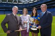 22 June 2005; The Foras na Gaeilge Senior Camogie Championship was launched in Croke Park today by Miriam O'Callaghan, Uachtaran Cumann Camogaiochta na nGael, and Joe McDonagh, right, Chief Executive, Foras na Gaeilge, with them at the launch are former Tipperary hurlinng star Len Gaynor and his daughter Ciara.  Picture credit; Ray McManus / SPORTSFILE