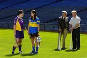 22 June 2005; The Foras na Gaeilge Senior Camogie Championship was launched in Croke Park today. Pictured at the launch are former hurling stars Len Gaynor, Tipperary, and Mick Jacob, Wexford, right, with their daughters Ursula (Jacob), left, and Ciara (Gaynor). Croke Park, Dublin. Picture credit; Ray McManus / SPORTSFILE