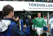 8 June 2005; A cameraman focuses on John O'Shea, Republic of Ireland, as he makes his way onto the pitch. FIFA 2006 World Cup Qualifier, Faroe Islands v Republic of Ireland, Torsvollur Stadium, Torshavn, Faroe Islands. Picture credit; David Maher / SPORTSFILE