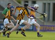 22 June 2005; Ciaran Kenny, Wexford, in action against Michael Fennelly, Kilkenny. U21 Leinster Hurling Championship Semi-Final, Wexford v Kilkenny, Wexford Park, Wexford. Picture credit; Matt Browne / SPORTSFILE