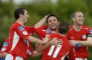 24 June 2005; Stuart Byrne, Shelbourne, is congratulated by team-mates Richie Baker,11, Jason Byrne, left, and  Owen Heary, after scoring Shelbournes second goal against Waterford United. eircom League, Premier Division, Waterford United v Shelbourne, Waterford RSC, Waterford. Picture credit; Matt Browne / SPORTSFILE