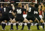 25 June 2005; British and Irish Lions captain Brian O'Driscoll and scrum-half Dwayne Peel, right, look on as New Zealand perform the &quot;Haka&quot; before the game. British and Irish Lions Tour to New Zealand 2005, 1st Test, New Zealand v British and Irish Lions, Jade Stadium, Christchurch, New Zealand. Picture credit; Brendan Moran / SPORTSFILE