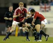 25 June 2005; Doug Howlett, New Zealand, is tackled by Paul O'Connell, left, and Jason Robinson, British and Irish Lions. British and Irish Lions Tour to New Zealand 2005, 1st Test, New Zealand v British and Irish Lions, Jade Stadium, Christchurch, New Zealand. Picture credit; Brendan Moran / SPORTSFILE