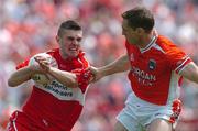 26 June 2005; Mark Lynch, Derry, in action against Kieran McGeeney, Armagh. Bank of Ireland Ulster Senior Football Championship Semi-Final, Armagh v Derry, Casement Park, Belfast. Picture Credit; David Maher / SPORTSFILE
