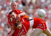 26 June 2005; Derry's Enda Muldoon, 15, and Patsy Bradley, back, in action against Oisin McConville, Armagh. Bank of Ireland Ulster Senior Football Championship Semi-Final, Armagh v Derry, Casement Park, Belfast. Picture Credit; David Maher / SPORTSFILE