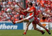 26 June 2005; Kieran McGeeney, Armagh, in action against Patsy Bradley, Derry. Bank of Ireland Ulster Senior Football Championship Semi-Final, Armagh v Derry, Casement Park, Belfast. Picture Credit; David Maher / SPORTSFILE