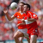 26 June 2005; Eoin Bradley, Derry, in action against Paul McGrane, Armagh. Bank of Ireland Ulster Senior Football Championship Semi-Final, Armagh v Derry, Casement Park, Belfast. Picture Credit; David Maher / SPORTSFILE