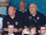 26 June 2005; Joe Kernan, right, Armagh manager, watches from the stands with Benny Tierney, Armagh goalkeeping coach, during the game. Bank of Ireland Ulster Senior Football Championship Semi-Final, Armagh v Derry, Casement Park, Belfast. Picture Credit; David Maher / SPORTSFILE