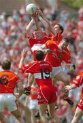 26 June 2005; Paul McGrane, Armagh, contests a high ball against Fergal Doherty, Derry. Bank of Ireland Ulster Senior Football Championship Semi-Final, Armagh v Derry, Casement Park, Belfast. Picture Credit; David Maher / SPORTSFILE