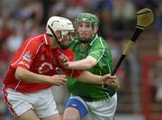 26 June 2005; Patrick Cronin, Cork, goes round Limerick's Seamus Hickey on his way to scoring a goal. Munster Minor Hurling Championship Final, Cork v Limerick, Pairc Ui Chaoimh, Cork. Picture Credit; Ray McManus / SPORTSFILE