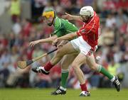 26 June 2005; Peter O'Brien, Cork, in action against Don Hanley, Limerick. Munster Minor Hurling Championship Final, Cork v Limerick, Pairc Ui Chaoimh, Cork. Picture Credit; Ray McManus / SPORTSFILE