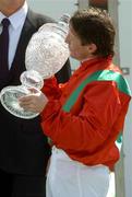 26 June 2005; Jockey Kieran Fallon kisses the trophy after his mount Hurricane Run had won the Budweiser Irish Derby. Curragh Racecourse, Co. Kildare. Picture credit; Damien Eagers / SPORTSFILE