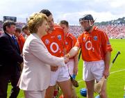26 June 2005; President of Ireland Mary McAleese is introduced to Brian Corcoran by Cork Captain Sean Og O'hAilpin before the start. Guinness Munster Senior Hurling Championship Final, Cork v Tipperary, Pairc Ui Chaoimh, Cork. Picture Credit; Ray McManus / SPORTSFILE