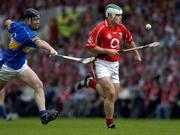 26 June 2005; Niall McCarthy, Cork, in action against David Kennedy, Tipperary. Guinness Munster Senior Hurling Championship Final, Cork v Tipperary, Pairc Ui Chaoimh, Cork. Picture Credit; Ray McManus / SPORTSFILE