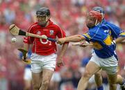 26 June 2005; Ben O'Connor, Cork, has the sliothar knocked from his hurley by Diarmaid Fitzgerald, Tipperary. Guinness Munster Senior Hurling Championship Final, Cork v Tipperary, Pairc Ui Chaoimh, Cork. Picture Credit; Ray McManus / SPORTSFILE