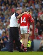 26 June 2005; Brian Corcoran, Cork, is consoled by Dr. Con Murphy as he retires injured. Guinness Munster Senior Hurling Championship Final, Cork v Tipperary, Pairc Ui Chaoimh, Cork. Picture Credit; Ray McManus / SPORTSFILE